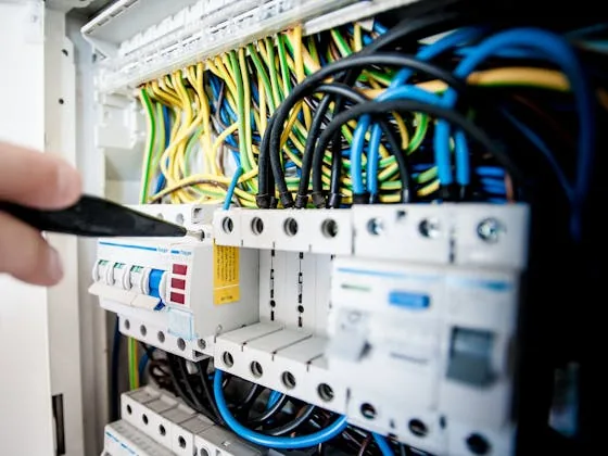 Closeup of a modern circuit breaker panel with neatly organized breakers and labeled circuits installed by Sammy Electrical Services