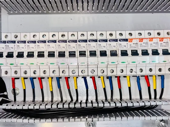 Modern circuit breaker panel with organized color-coded wiring installed by Sammy Electrical Services